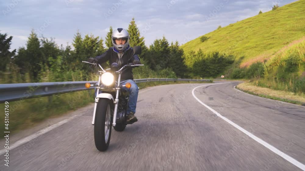 Man out for a relaxing ride on his motorcycle Man out for a relaxing ride on his motorcycle