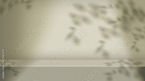 Green color background with shadow of leaves on wall.