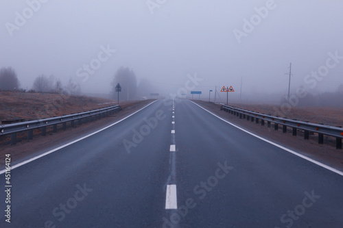 road in fog concept, mist in october halloween landscape, highway © kichigin19