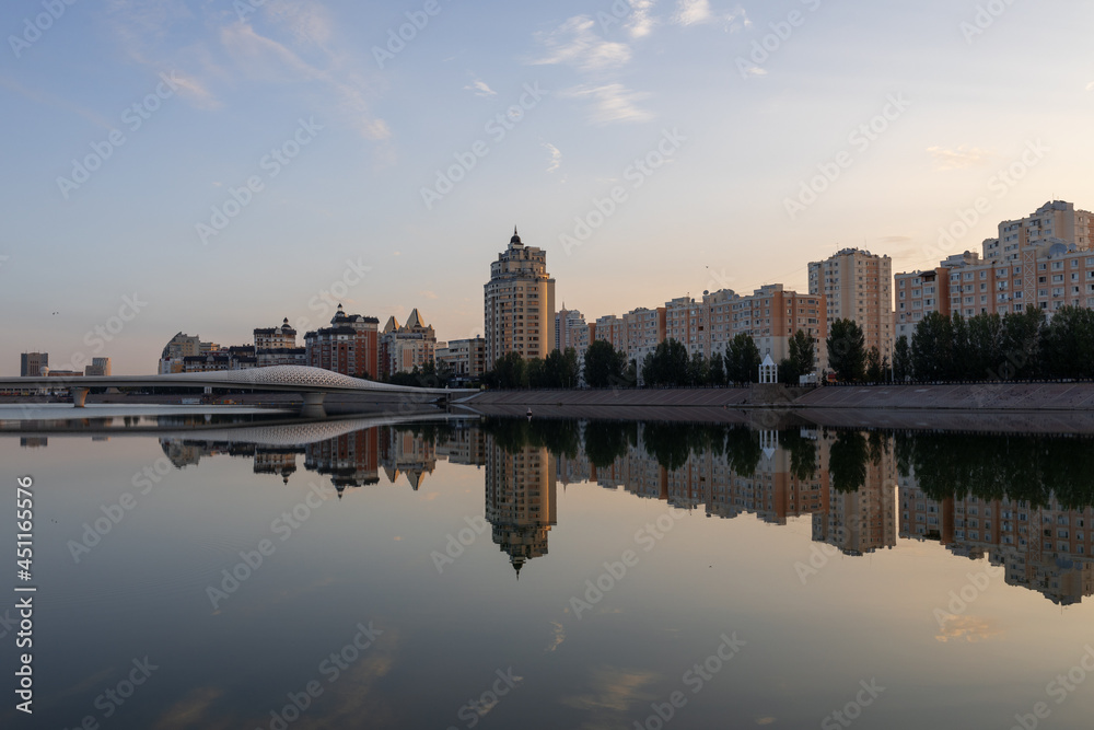 View on Azirbaijan Mambetov street from Karaotkel bridge at sunrise time. Nur-Sultan, Kazakhstan.