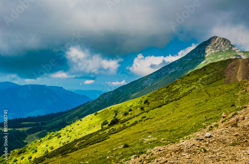 Fototapeta Naklejka Na Ścianę i Meble -  Beautiful Summer sunny mountains with clouds and meadow