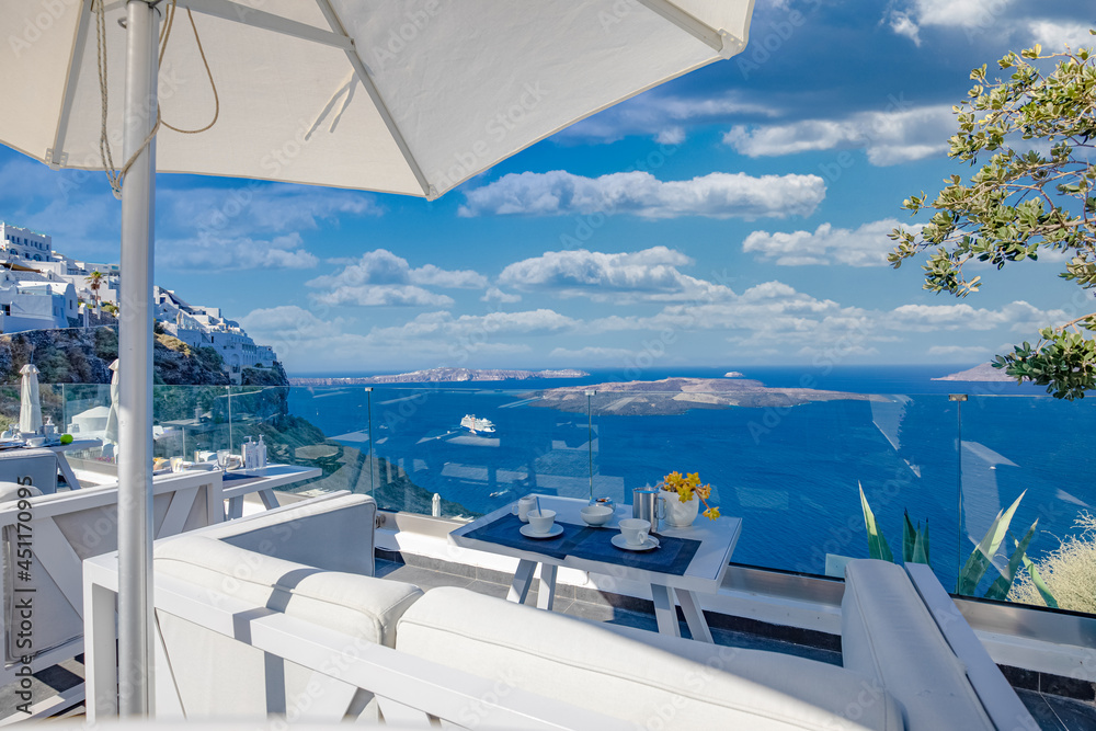 07.22.21: Morning fresh juice and breakfast with blue sea view. Couple traveling and honeymoon destination, idyllic morning scenic, bright caldera view in Greece, Santorini island. Romantic landscape