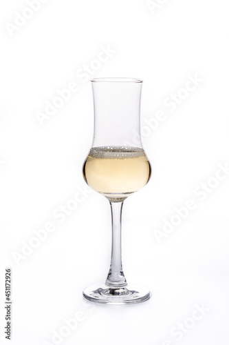 Italian golden grappa drink isolated on white background