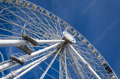 AMUSEMENT PARK - Ferris whell against the blue sky 