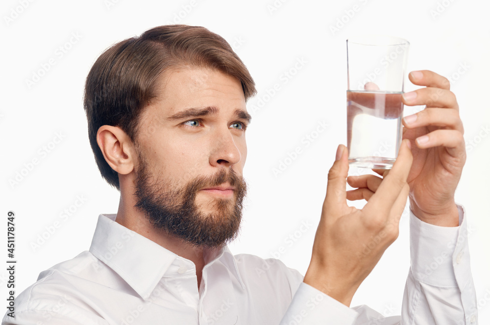 man in white shirt drinking water isolated background man in white shirt drinking water isolated background