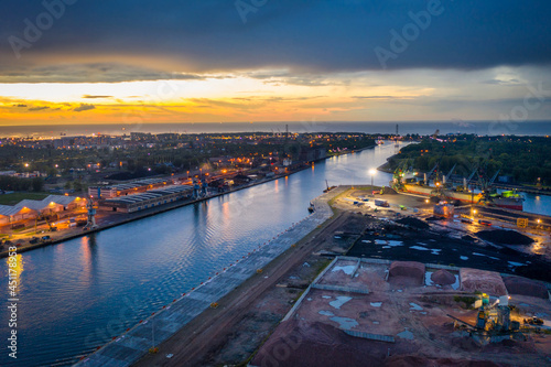 Scenery of the shipyard in Gdansk with Martwa Wisla canal at dusk. Poland.