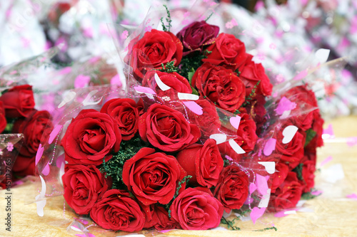 Fototapeta Naklejka Na Ścianę i Meble -  Close-up of beautiful red roses bouquet. Valentine Day and celebration. Selected Focus. 