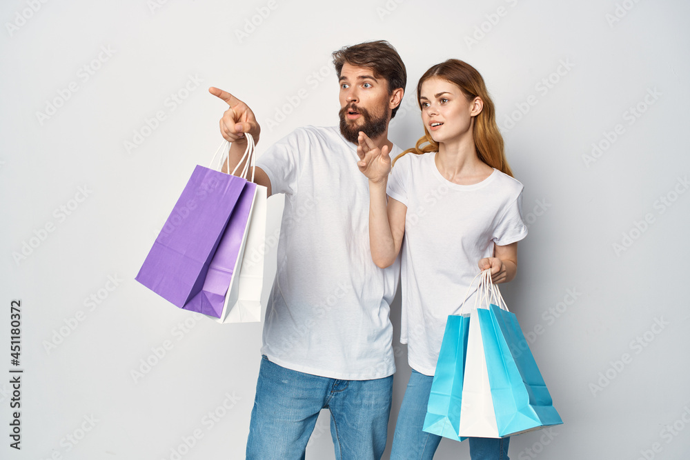 man and woman with packages in their hands discounts Shopping man and woman with packages in their hands discounts Shopping