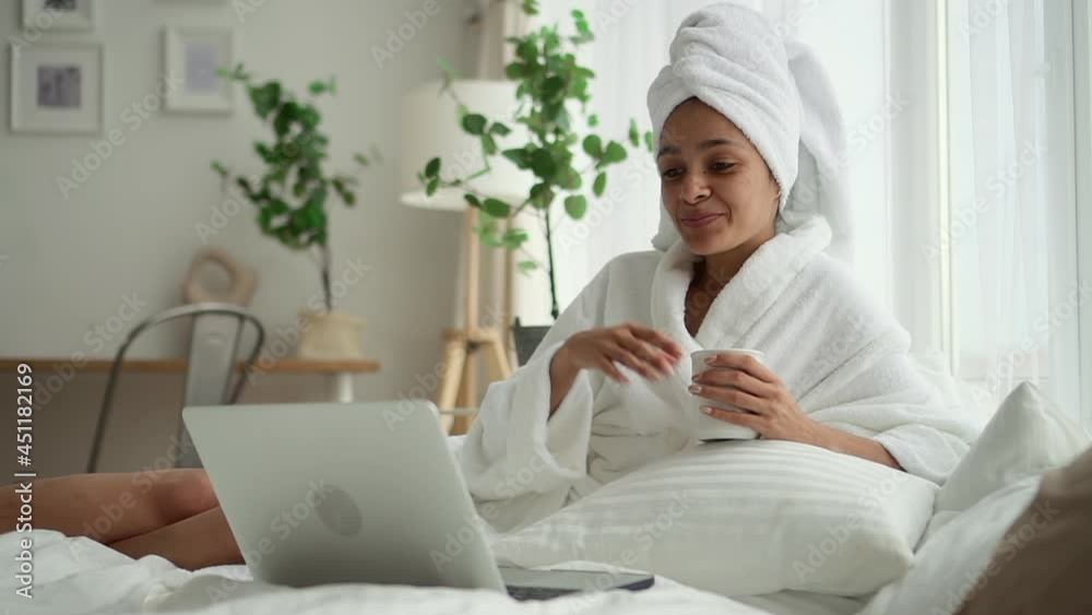 Beauty treatment videocall at resort black lady with laptop Spbd Beauty treatment videocall at resort black lady with laptop Spbd