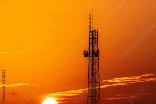 Silhouette of telecommunication tower during sunset
