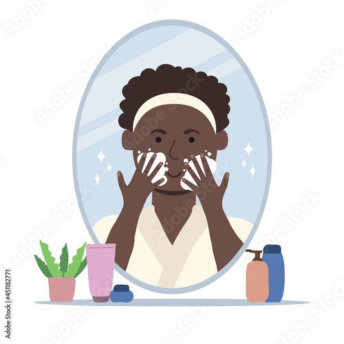 Young man cleaning his face with foam soap. Men's skin care concept.