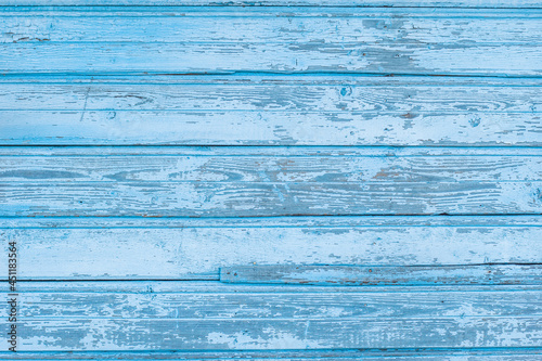 Background of old painted blue boards with peeling paint, space for text, layout