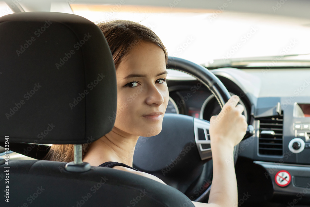 driving school, student driver takes an exam in a car to obtain a driver's license