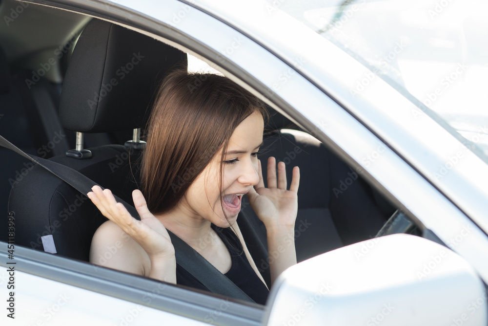 fear of driving,driver girl screams at the wheel, is afraid to drive a car fear of driving,driver girl screams at the wheel, is afraid to drive a car