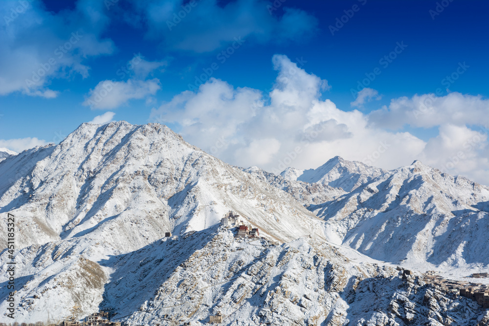 View of Leh palace situated amidst snow claded Himalayan mountain in Leh, Ladakh, India