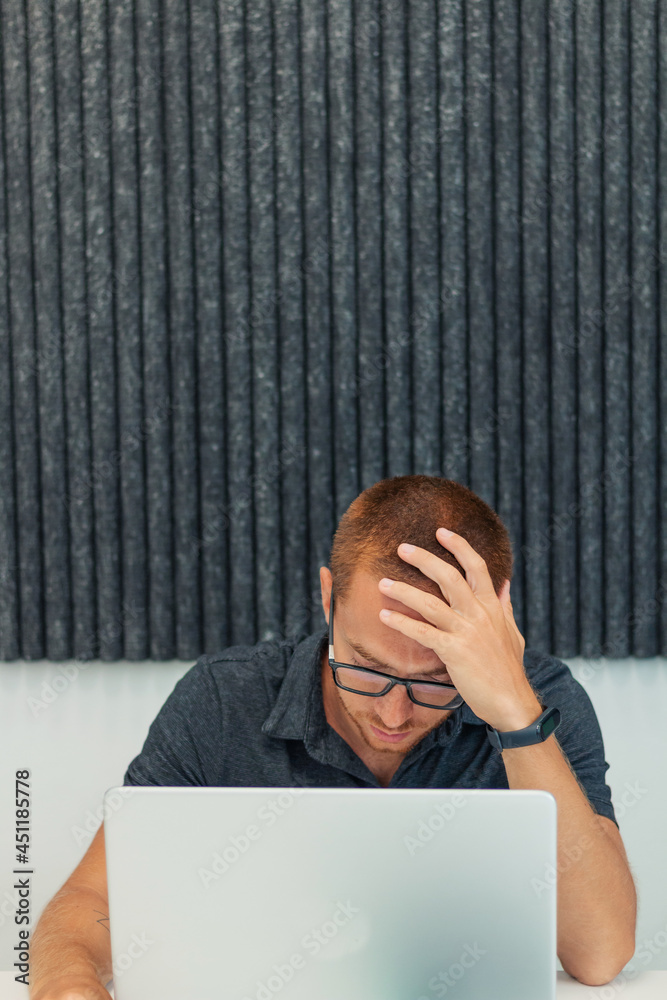 Worried businessman in front of computer Worried businessman in front of computer