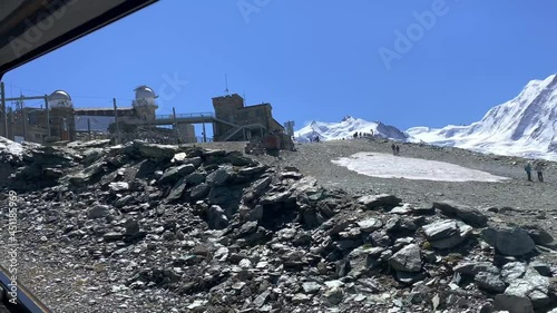 View of the passengers from the window of the Matterhorn Gornergrat Bahn. In the background you can see the mountain station and the beautiful mountain panorama of Zermatt photo