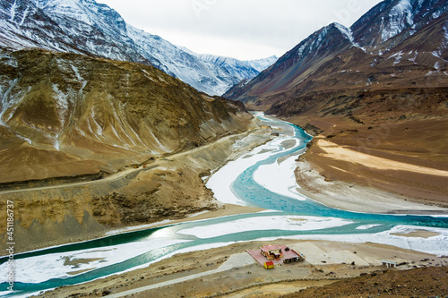Confluence of the Indus and Zanskar Rivers which are almost frozen due to extreme cold during winter and famous for chadar trek at leh,Ladakh,India photo