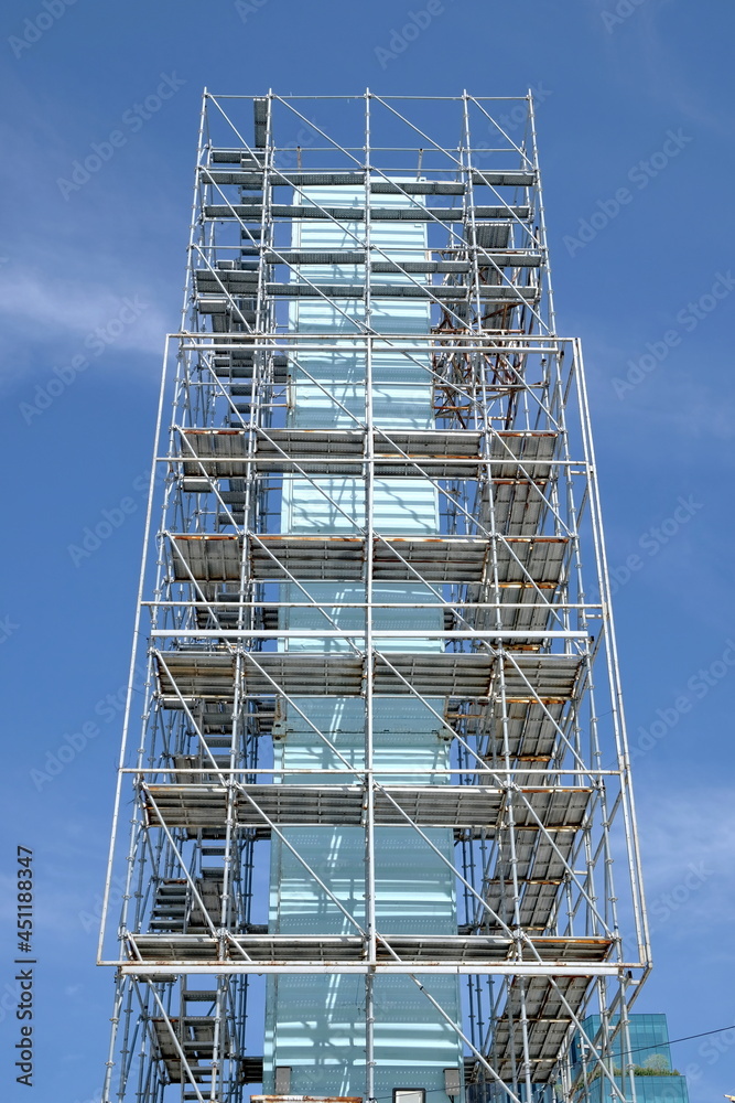 Supported metal scaffolds soar into blue sky