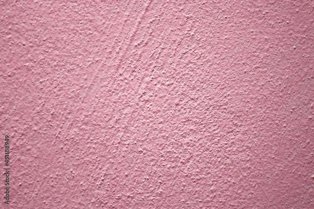 Pink cement wall texture for background and design artwork. Pink cement wall texture for background and design artwork.