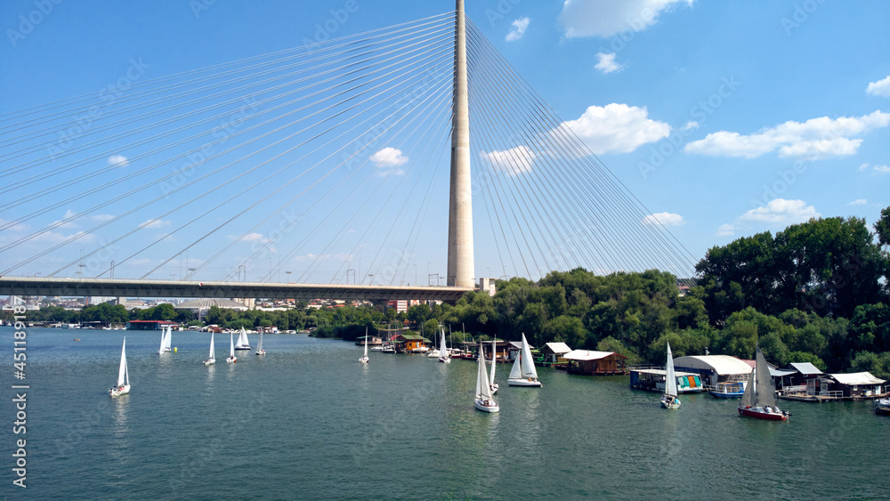 Drone view of bridge, river and boats at summertime - Belgrade, Serbia. Drone view of bridge, river and boats at summertime - Belgrade, Serbia.