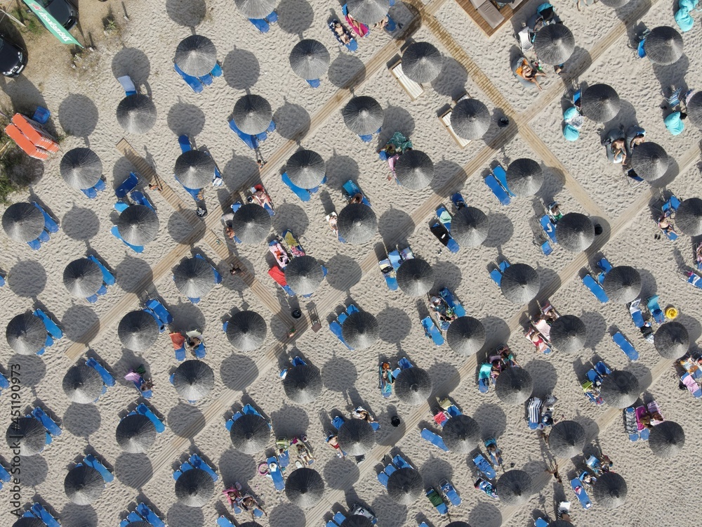 Fototapeta premium Aerial view of kanali beach crowded with tourists, famous tourist destination in preveza, epirus, greece
