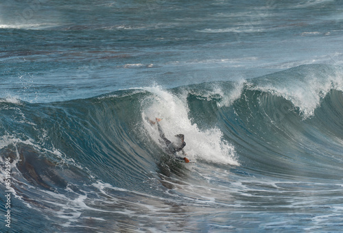Bodyboarder in action on the ocean waves on the last hours of the  day in Gran Canaria. Canary islands. close up
