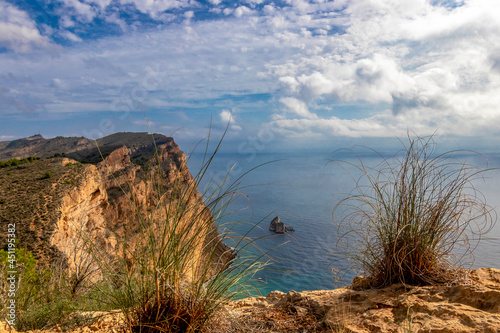 natural park serra gelada in benidorm. view of cliffs in a clouds sky, landscape located in the Valencian community, Alicante, Spain photo