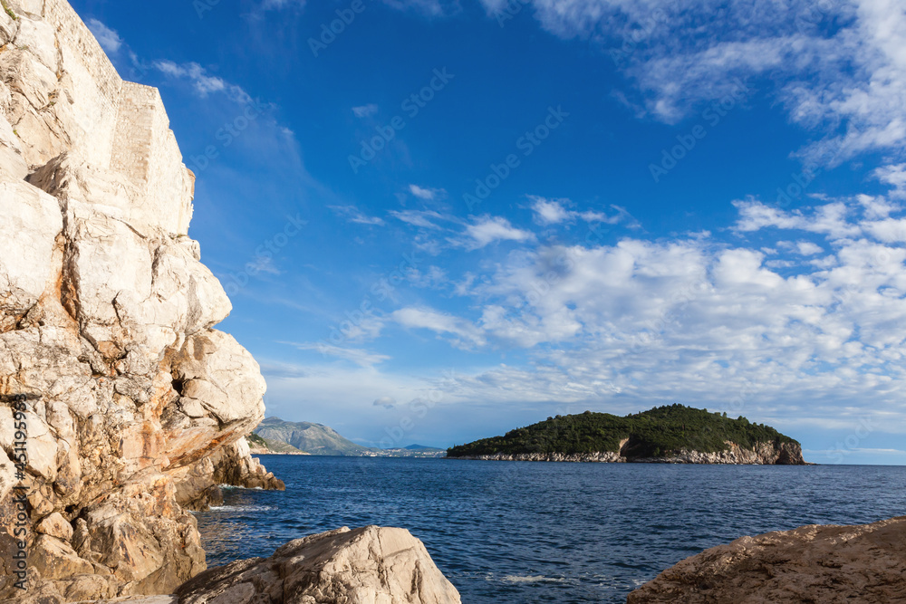 Looking south to the island of Lokrum, from below the city walls: Dubrovnik, Croatia
