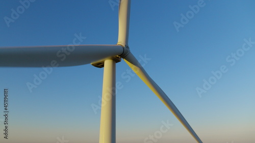Windmill propeller rotating in closeup. Wind turbine producing renewable energy.