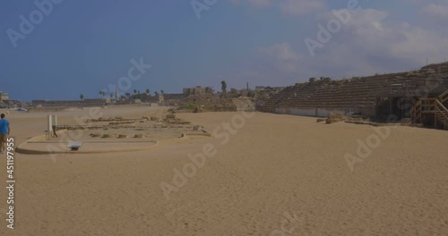 Panoramic View Of The Theatre At Caesarea National Park In Caesarea, Israel On A Sunny Day. panning left photo