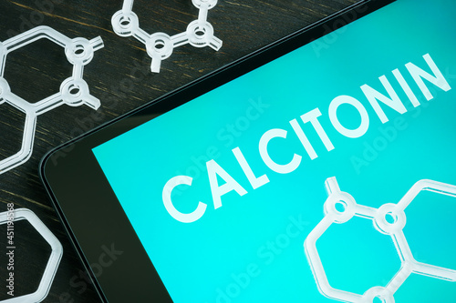 Calcitonin hormone on the notepad screen and chemical symbols. photo