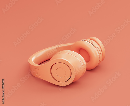 Monochrome orange color professional headphone on the floor in a pink studio, 3d rendering