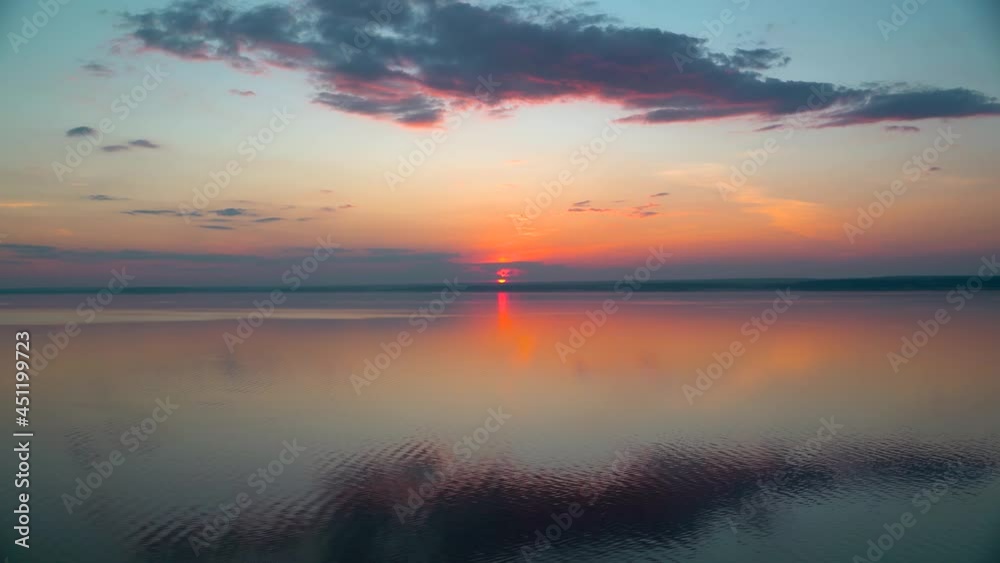 A gorgeous sunset on the sea with light waves with incredible colors. 4k video. A gorgeous sunset on the sea with light waves with incredible colors. 4k video.