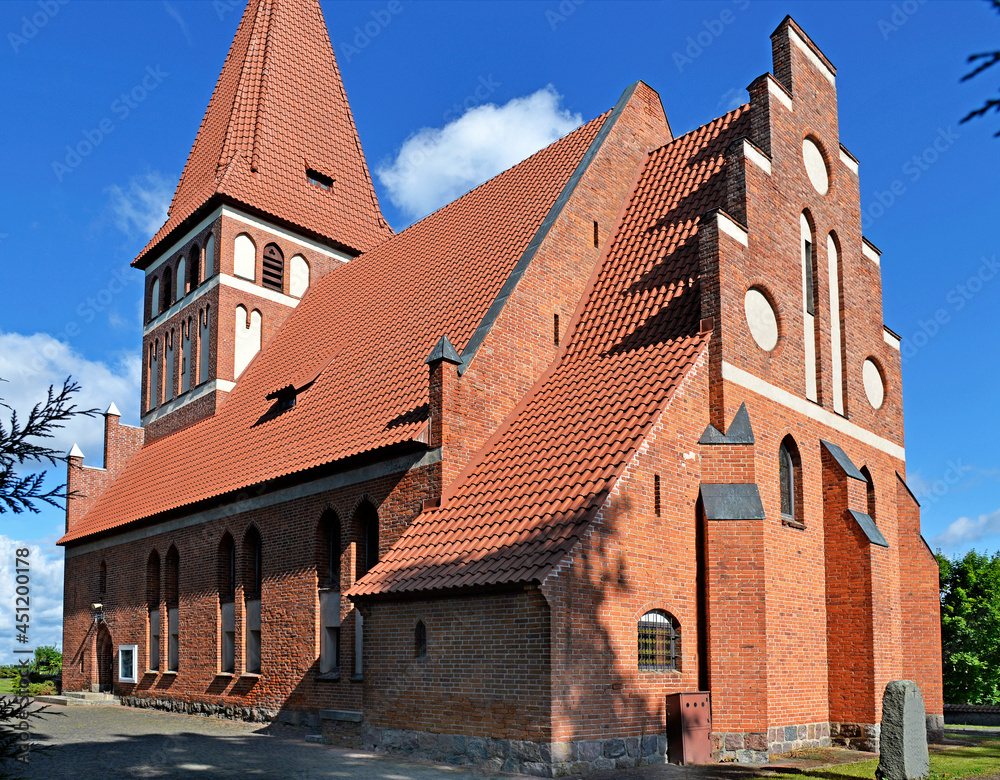 General view and architectural details of the Catholic Church of Our Lady Queen of Poland, built in 1894 in the Gothic style, in Pisanica in Masuria, Poland. General view and architectural details of the Catholic Church of Our Lady Queen of Poland, built in 1894 in the Gothic style, in Pisanica in Masuria, Poland.