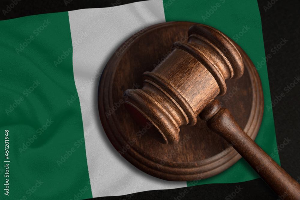 Judge Gavel and flag of Nigeria. Law and justice in Nigeria. Violation of rights and freedoms