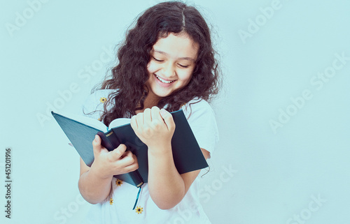 Columbia girl redading a book and smiling photo