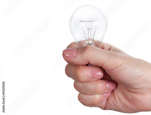 Woman's hand holding a light bulb isolated on white background. Mock up of green energy and innovation concept
