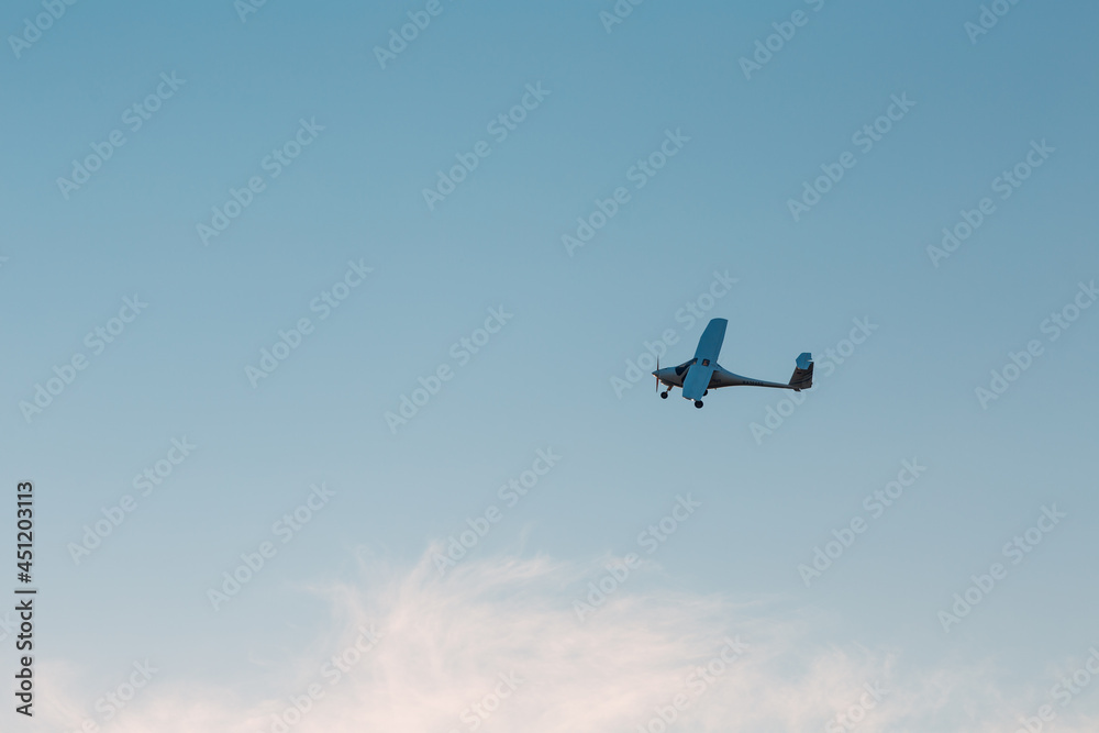 Small single engine airplane flying against sunset sky. Small single engine airplane flying against sunset sky.