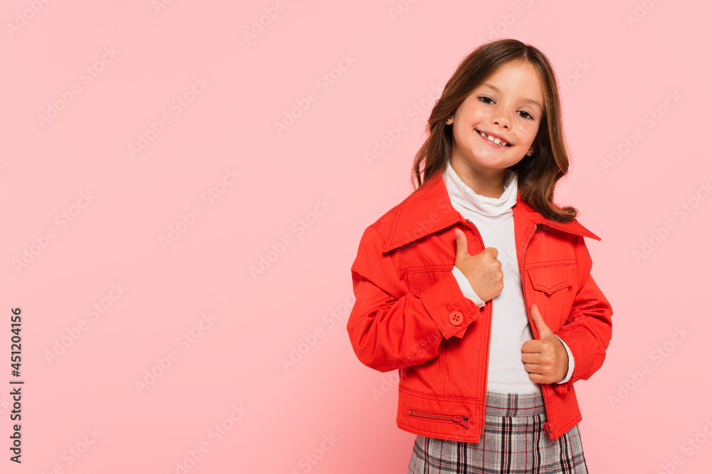 cheerful girl in orange jacket smiling at camera isolated on pink cheerful girl in orange jacket smiling at camera isolated on pink