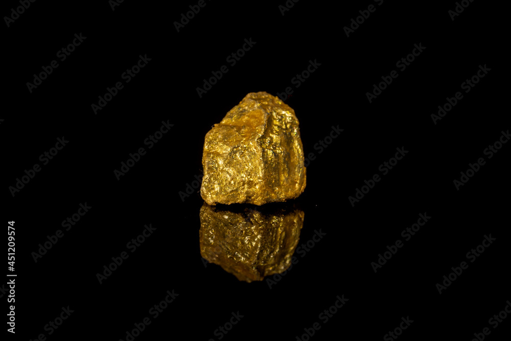 Gold concept, close-up of large gold nuggets Gold concept, close-up of large gold nuggets
