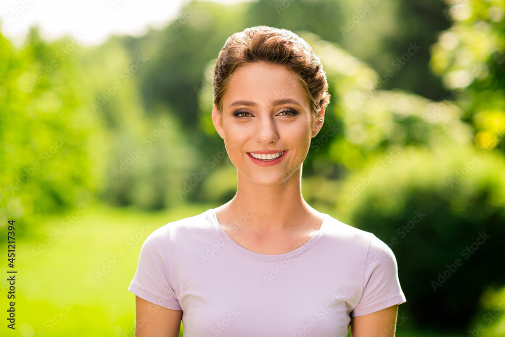Portrait of attractive cheerful content brown-haired girl spending free time outside breathing fresh air outdoors Portrait of attractive cheerful content brown-haired girl spending free time outside breathing fresh air outdoors