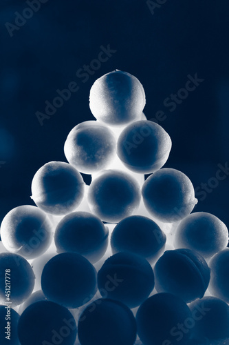 snowballs heap on dark blue background