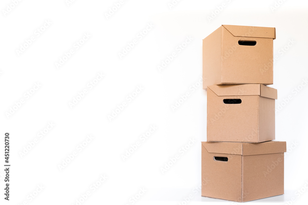 stack of delivery or parcels cardboard boxes on a white background with copy space. shipping and logistics. Online shopping and delivery concept. 