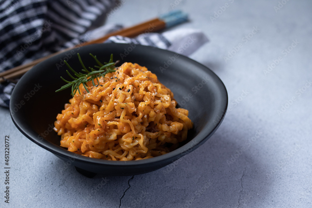 Korean instant noodles cheese flavor in a black cup