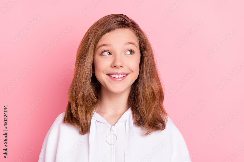 Photo of sweet charming small schoolgirl dressed white sweatshirt smiling looking empty space isolated pink color background Photo of sweet charming small schoolgirl dressed white sweatshirt smiling looking empty space isolated pink color background