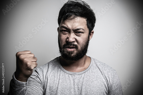 Foto Asian handsome man angry on white background,Portrait of young Stress male conce