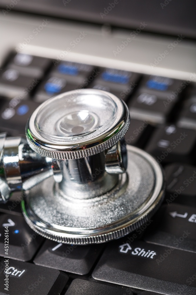 Medical steel stethoscope on Computer Keyboard Medical steel stethoscope on Computer Keyboard