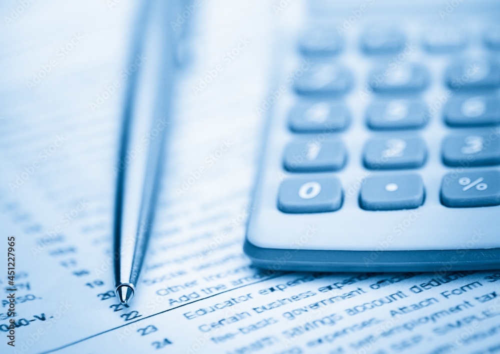 Composition of close up of calculator and pen on table Composition of close up of calculator and pen on table