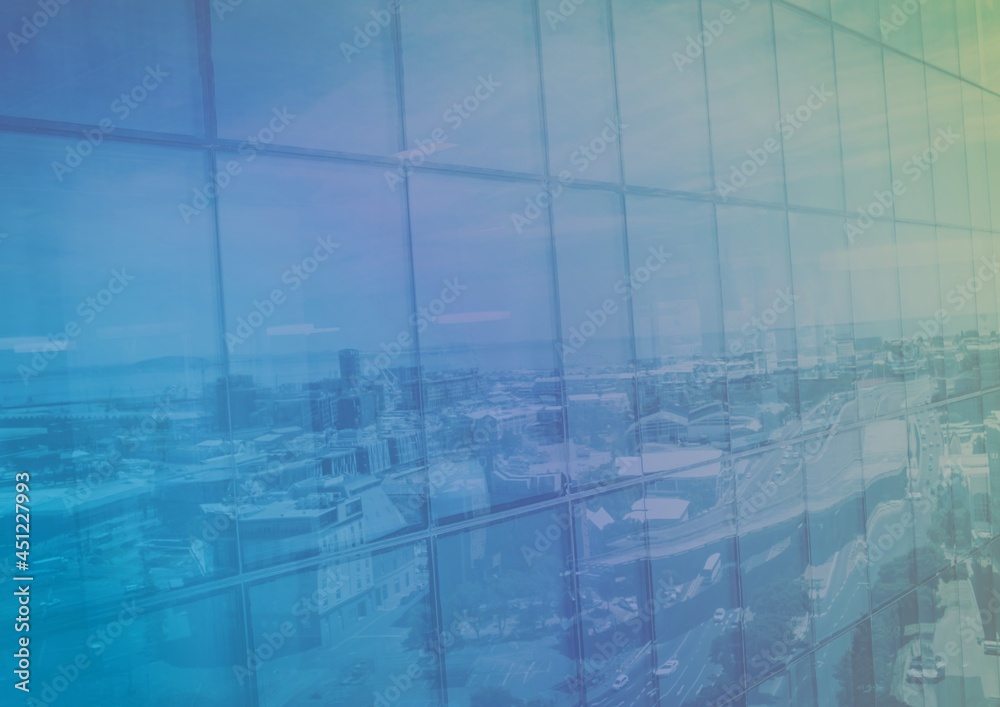 Fototapeta premium Composition of colorful light over cityscape reflected in window